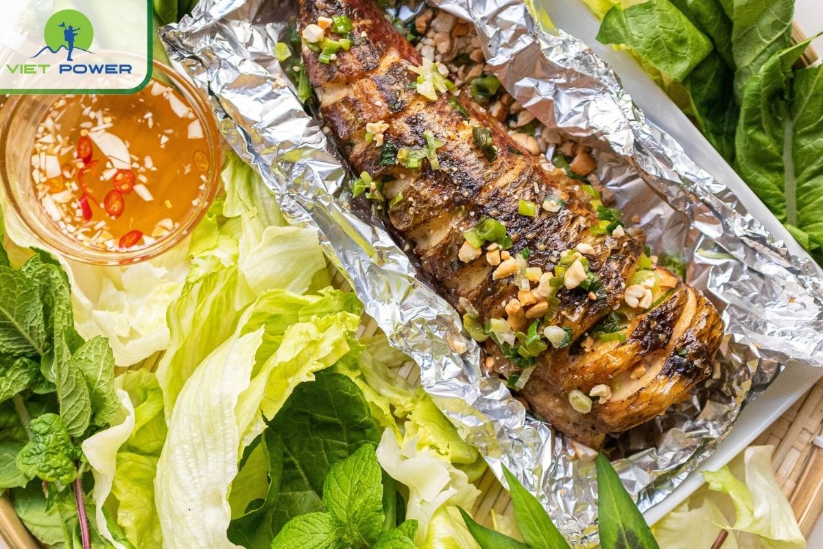 Ca loc nuong trui, a rustic grilled snakehead fish, is a beloved specialty in Vietnam